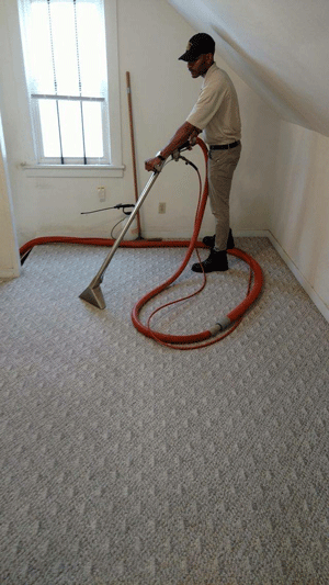 Man cleaning carpet from Pensicola Carpet & Upholstery Maintenance Inc
